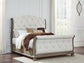 Ardenfield  Upholstered Sleigh Bed With Mirrored Dresser And Nightstand