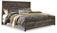 Cama Wynnlow con panel y cómoda con espejo y mesita de noche