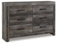Cama Wynnlow con panel y cómoda con espejo y mesita de noche