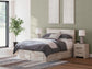 Cama con cabecero Lawroy, cómoda y espejo